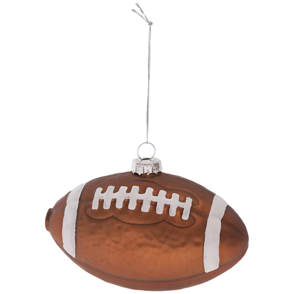 Glass football ornament with a string on a white background