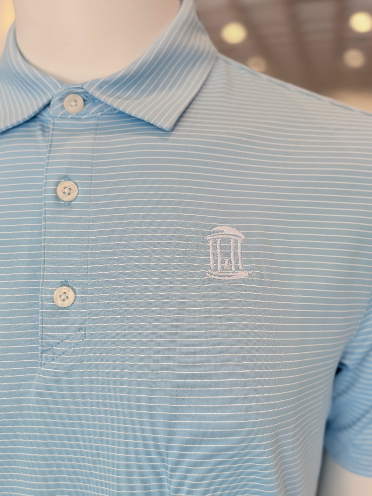 UNC Old Well Logo Forge Eco Fine Striped Polo by Cutter and Buck