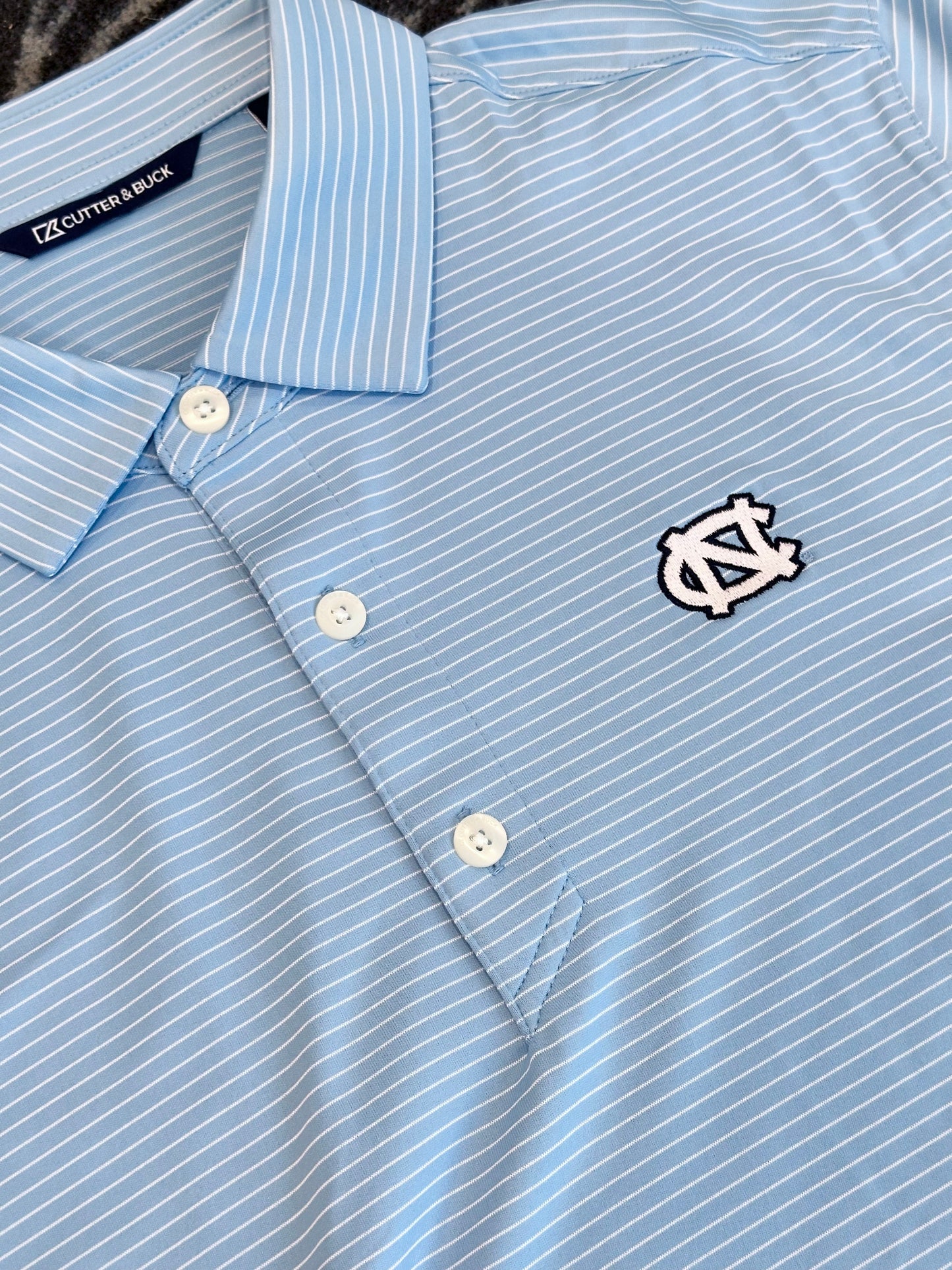 UNC Cutter & Buck Forge Epic Confidence Fine Line Stripe Stretch Recycled Mens Polo