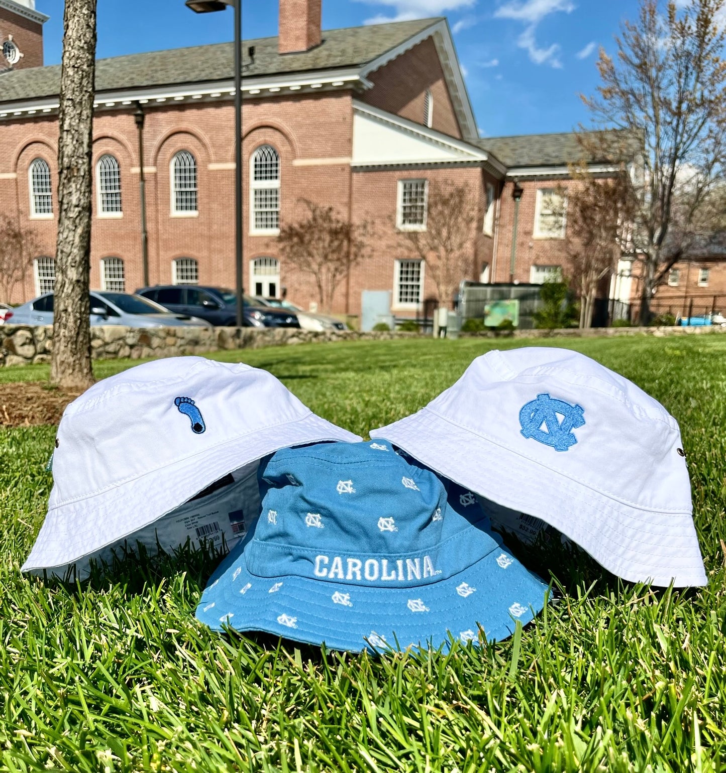 UNC Bucket Hat in White with North Carolina Interlock Logo in Carolina Blue