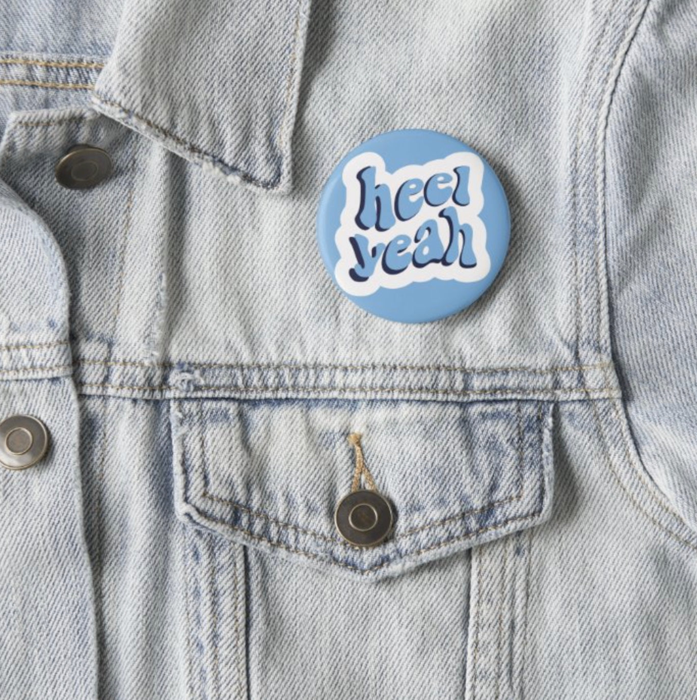 Heel Yeah Button Pin in Carolina Blue by Shrunken Head Brand