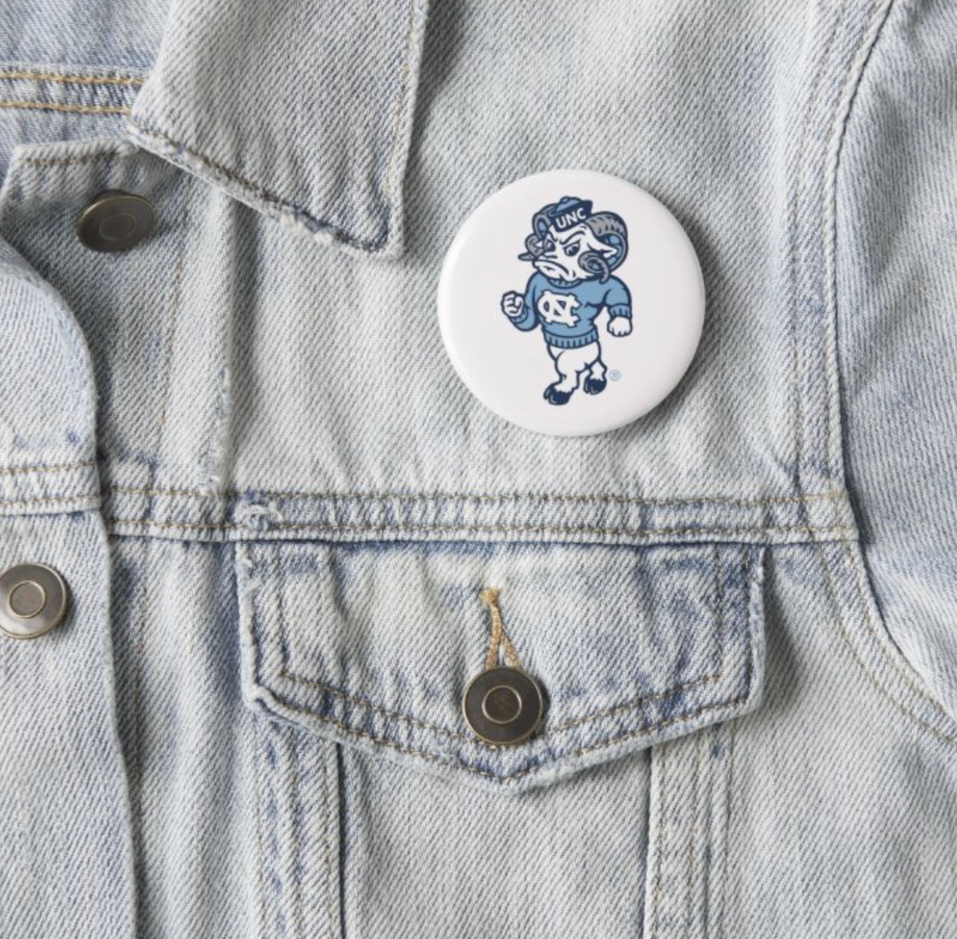 Rameses Logo Button Pin in Carolina Blue and White