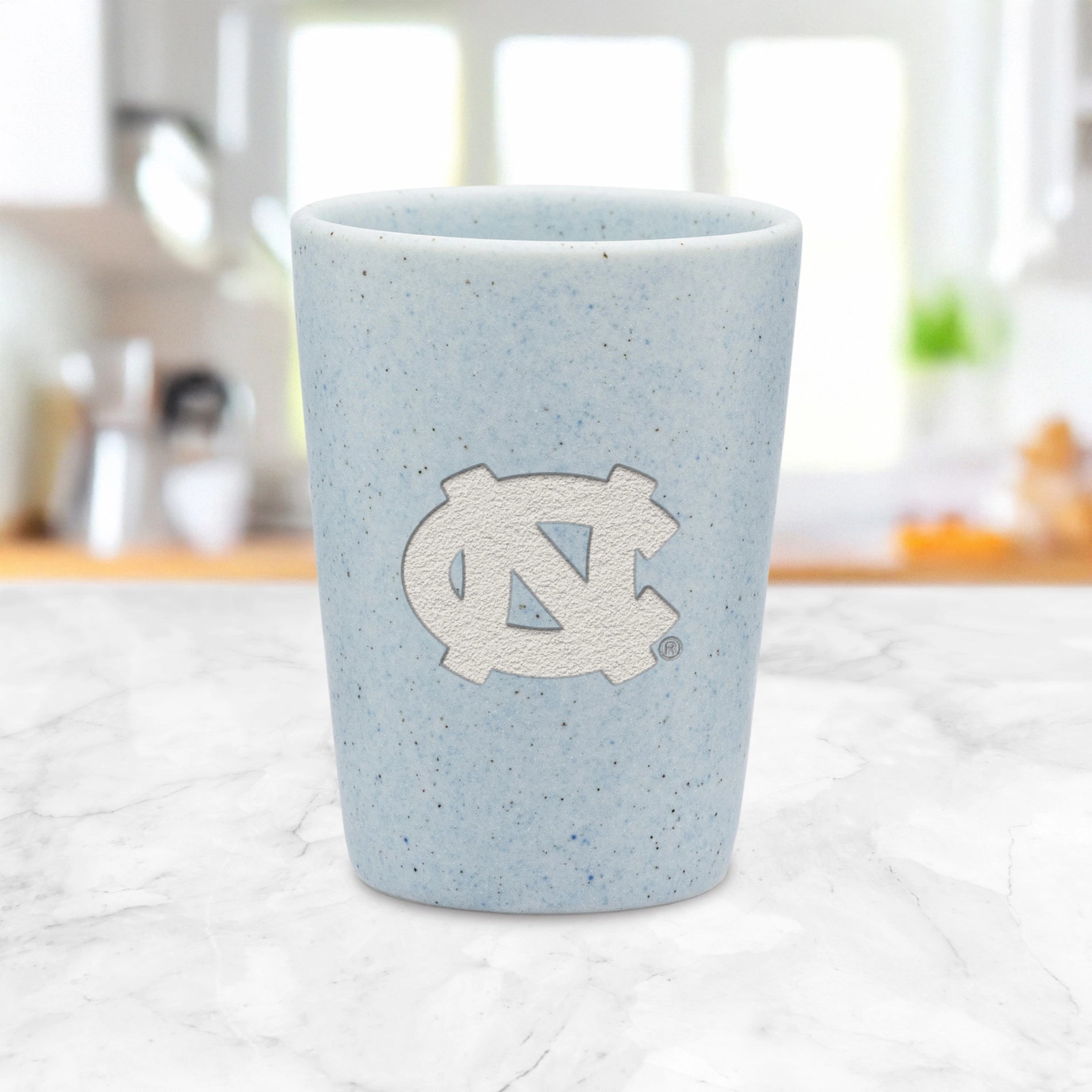 North Carolina Tar Heels Baby Blue 2oz Ceramic Shot - Lifestyle View - Rico Industries